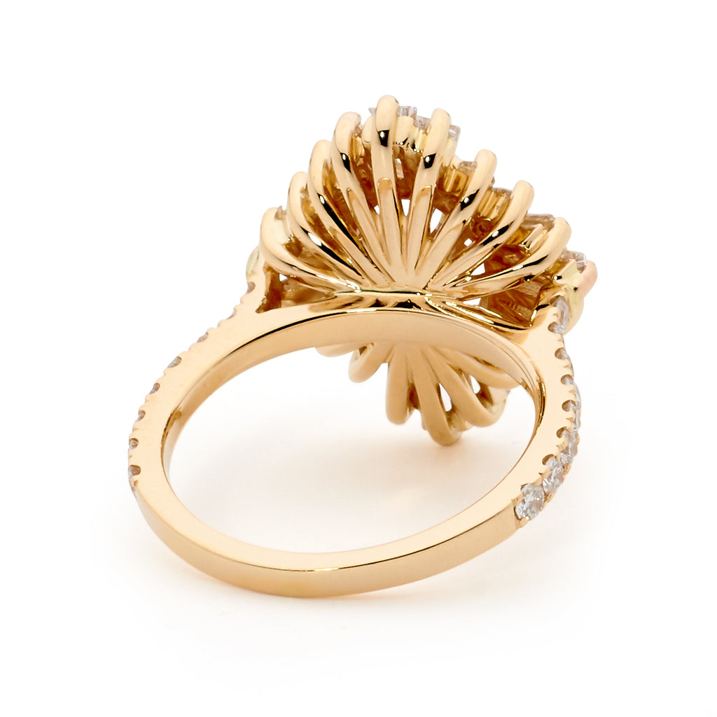 Gold ring with scalloped design and small side diamonds on a white background.