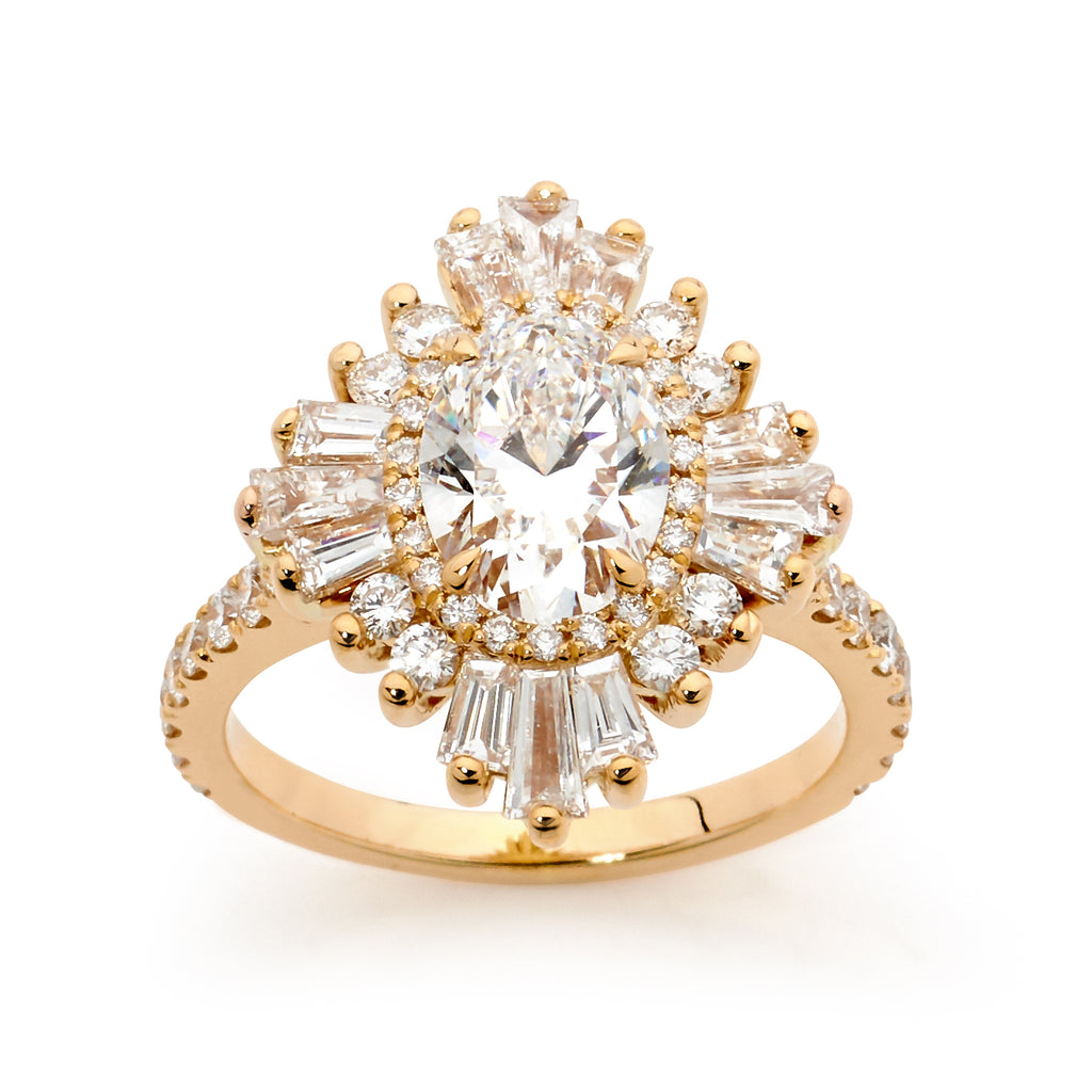 Gold ring with a central oval shaped diamond surrounded by smaller diamonds on a white background.